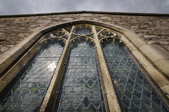 Church window perspective ancient and sunlit