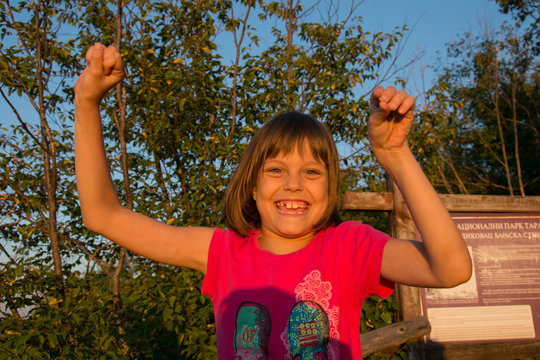 happy girl in nature at sunset