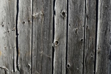 closeup of an old weathered wooden slat wall for backgrounds
