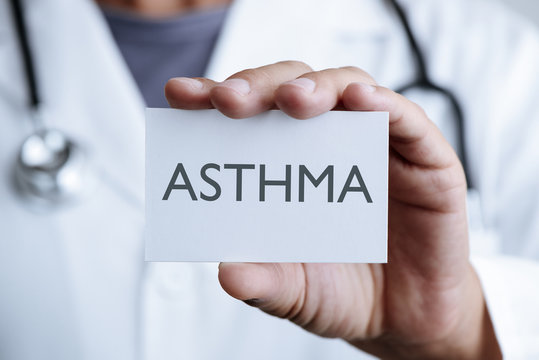 doctor and signboard with text asthma