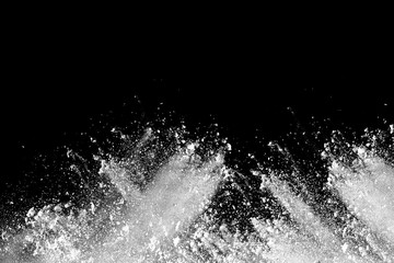 Launched white powder splash on black background.