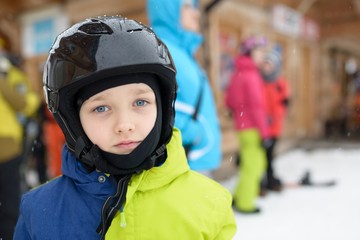 Little boy in ski helmet