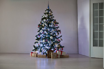 room decorated for Christmas Christmas tree gifts