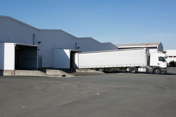 Fototapeta na wymiar Cargo Transportation with Truck in the warehouse