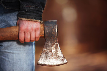 a lumberjack works with an axe in the forest