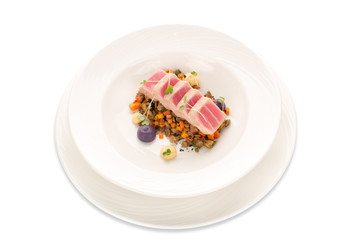 Molecular modern cuisine tuna with lentil and vegetable isolate. Seared Tuna raw fish Asian style on a white plate