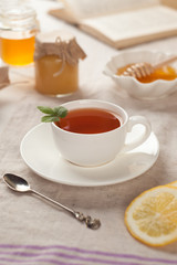 Black herbal tea with lemon and honey. hot winter drink