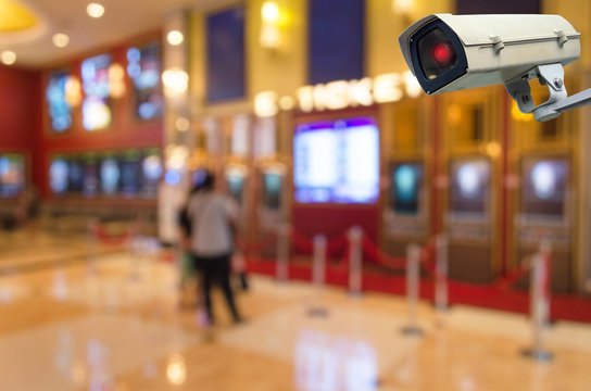 CCTV, security indoor camera system operating at movie theater, surveillance security and safety technology concept