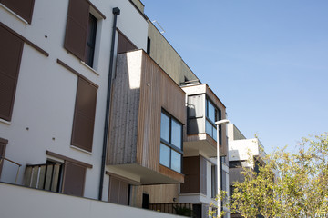 Apartment block flat blocks building blue sky background