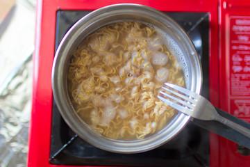 Cooking instant noodle.