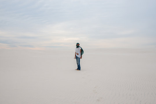 Traveler, lost in the desert, waiting for the storm