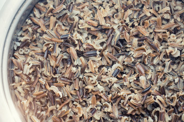 A pot with steamed black rice close-up