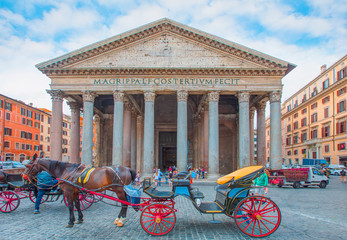 Tourists near Pantheon church on Piazza della Rotonda in Rome city. Pantheon is a former Roman temple