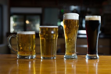 Close-up of beer glasses on the counter