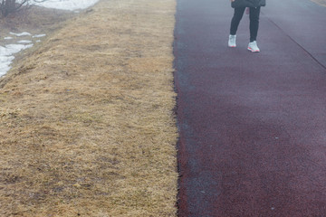 Yellow grass on the ground with tourist on path with fog at Mount Usu in winter in Hokkaido, Japan.