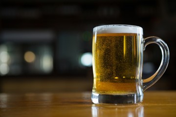 Close-up of beer glass on the counter