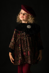 Pretty girl in brown old-fashioned costume