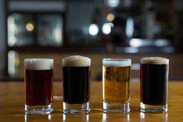 Close-up of beer glasses on the counter