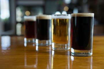 Close-up of beer glasses on the counter