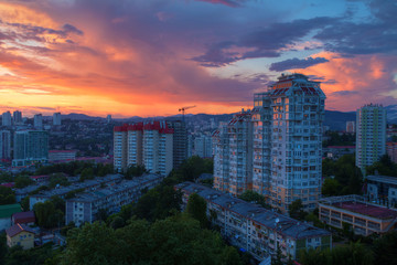 Obraz premium Aerial view of the Sochi city on the background of beautiful sky at sunset, Russia 