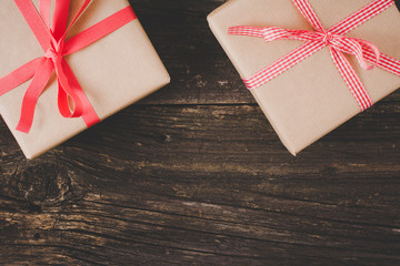 Gifts on wooden table. Christmas background. top view