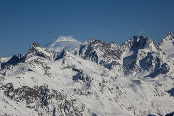 Winter mountains and peaks on a clear day.
