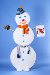 Beautiful funny Snowman in cap and scarf