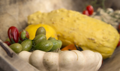 Green gooseberries with pumpkin in a wooden bowl © istvan76