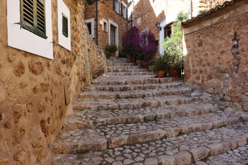 Romantic street in the picturesque small town Fornalutx, Majorca Spain