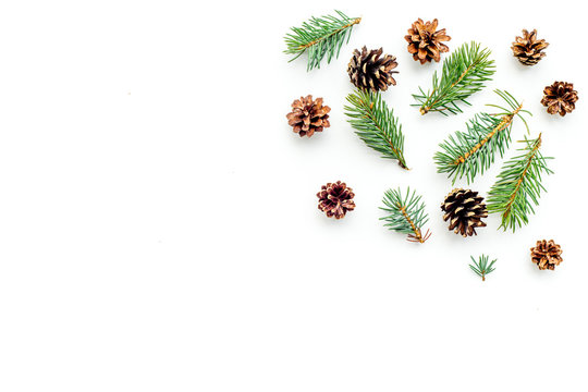 New year symbols pattern. Spruce branches and cones on white background top view copyspace