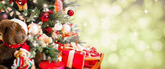 Christmas tree on blurred lights background.