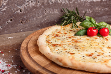 Thick delicious cheese pizza vegetarian dish with cherry tomato and herbs