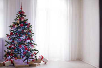 White room decorated for Christmas new year tree gifts