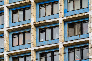 Obraz premium Facade of an old high-rise building. Urbanization concept