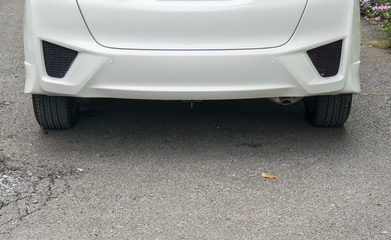 Lost license plate on white car., License plate car lost after the flood.