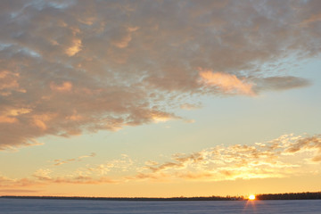 beautiful sunset in winter. Snow, frost, clouds