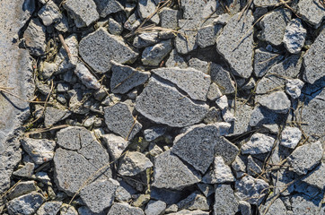 Destroyed concrete floor texture. Large broken pieces of concrete background