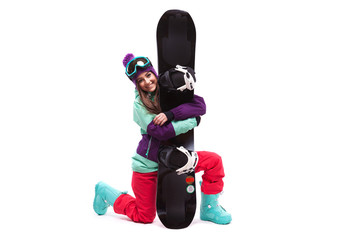 ski woman on one knee hugs snowboard