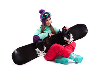 pretty young woman in purple ski costume siting cross-legged