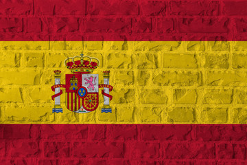 Spain Flag on brick wall texture background