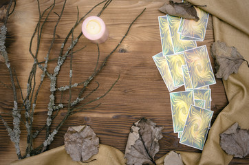 Tarot cards deck on wooden table with copy space. Fortune teller table.