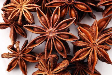 Anise star seeds on the wooden background. Aromatic ingredient in culinary