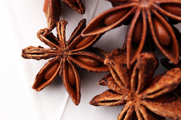 Anise star seeds on the wooden background. Aromatic ingredient in culinary