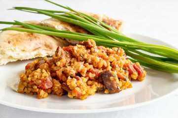 wheat pilaf, green onion, and pita bread