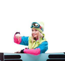pretty young woman in ski outfit sit near snowboard