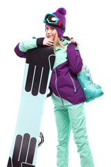 young beautiful woman in purple ski suit hold snow boots and snowboard