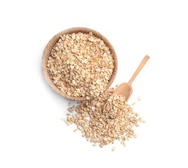 Bowl with raw oatmeal and scoop on white background