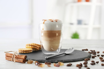 Glass with latte macchiato on blurred background - obrazy, fototapety, plakaty