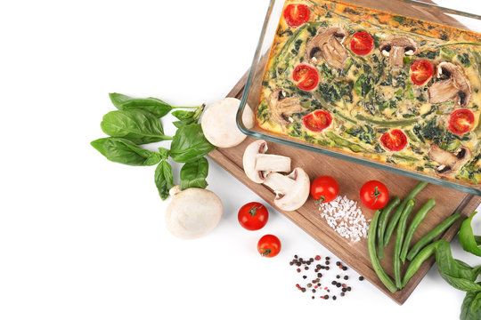 Composition With Spinach Frittata In Baking Dish, Isolated On White