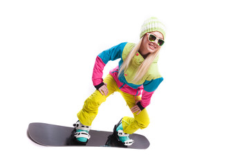 beauty young woman in ski suit and sunglasses ride snowboard